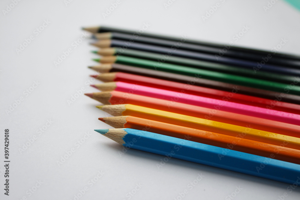 Wooden colored pencils isolated on white background. Creation. Place for text. Wooden colored pencils isolated on white background. Creation. Place for text.