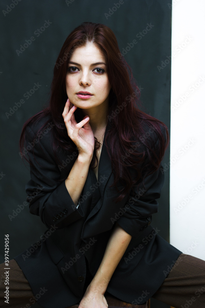Portrait of a young happy woman isolated on a blackboard. Portrait of a young happy woman isolated on a blackboard.