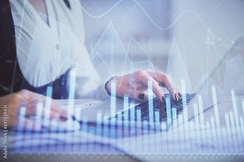 Double exposure of businesswoman hands typing on computer and forex graph hologram drawing. Financial analysis concept. Double exposure of businesswoman hands typing on computer and forex graph hologram drawing. Financial analysis concept.