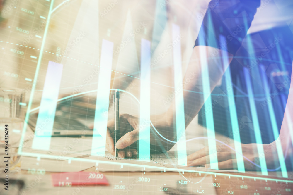 Fototapeta premium Multi exposure of woman hands typing on computer and financial chart hologram drawing. Stock market analysis concept.