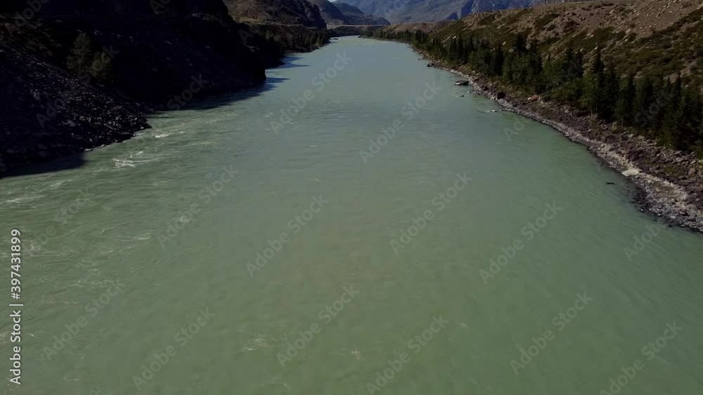 Flight over summer mountain river canyon with mountains and sky Flight over summer mountain river canyon with mountains and sky