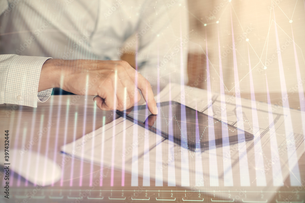 Double exposure of man's hands holding and using a digital device and forex graph drawing. Financial market concept. Double exposure of man's hands holding and using a digital device and forex graph drawing. Financial market concept.