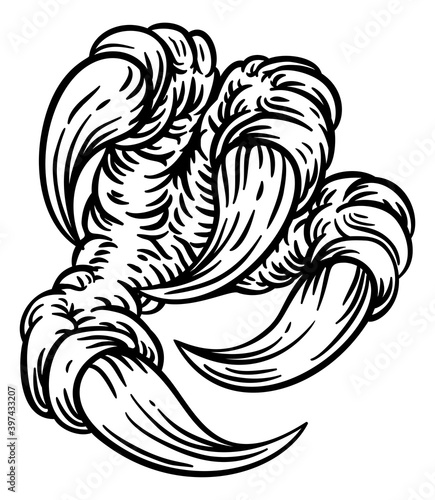 An eagle or monster dragon claw talon hand design in a vintage woodcut etching style