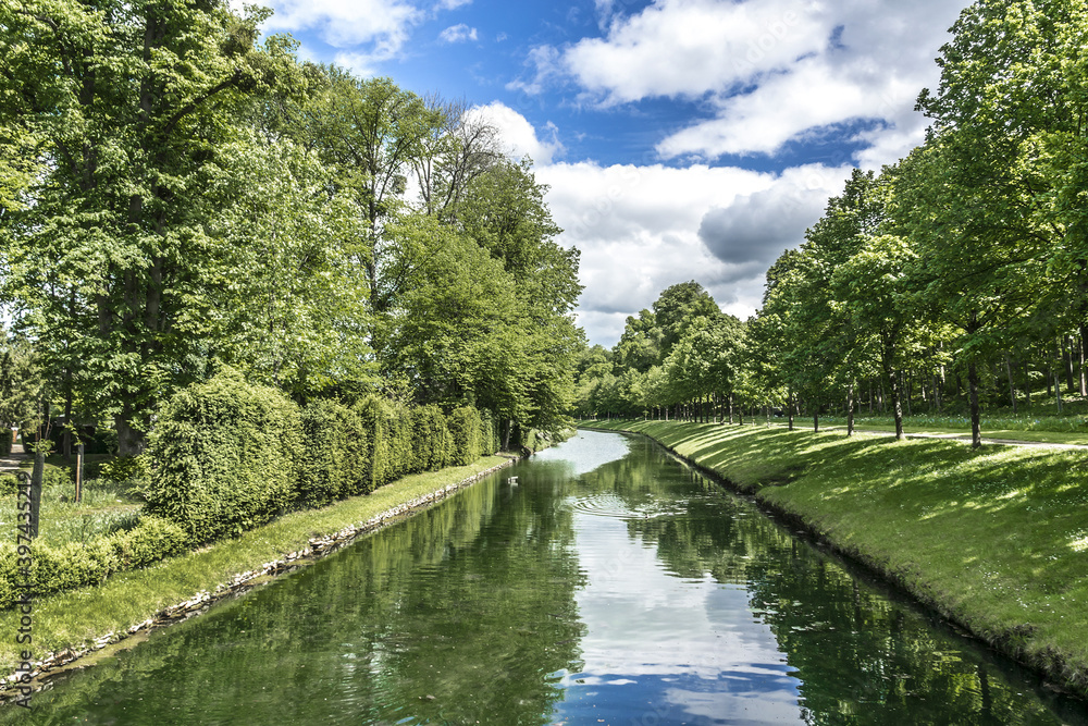 Beautiful views of the channel near famous Chateau de Chantilly (Chantilly Castle, 1560) - historic chateau located in town of Chantilly, Oise, Picardie, France. Beautiful views of the channel near famous Chateau de Chantilly (Chantilly Castle, 1560) - historic chateau located in town of Chantilly, Oise, Picardie, France.