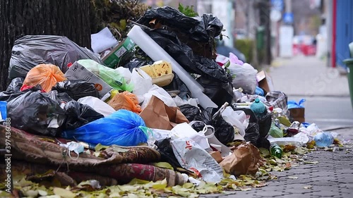 Piles of household waste are abandoned on the streets of Bucharest