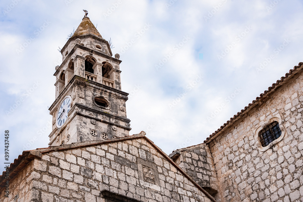Tower of the Cathedral with a clock on the island of Vis, Croatia