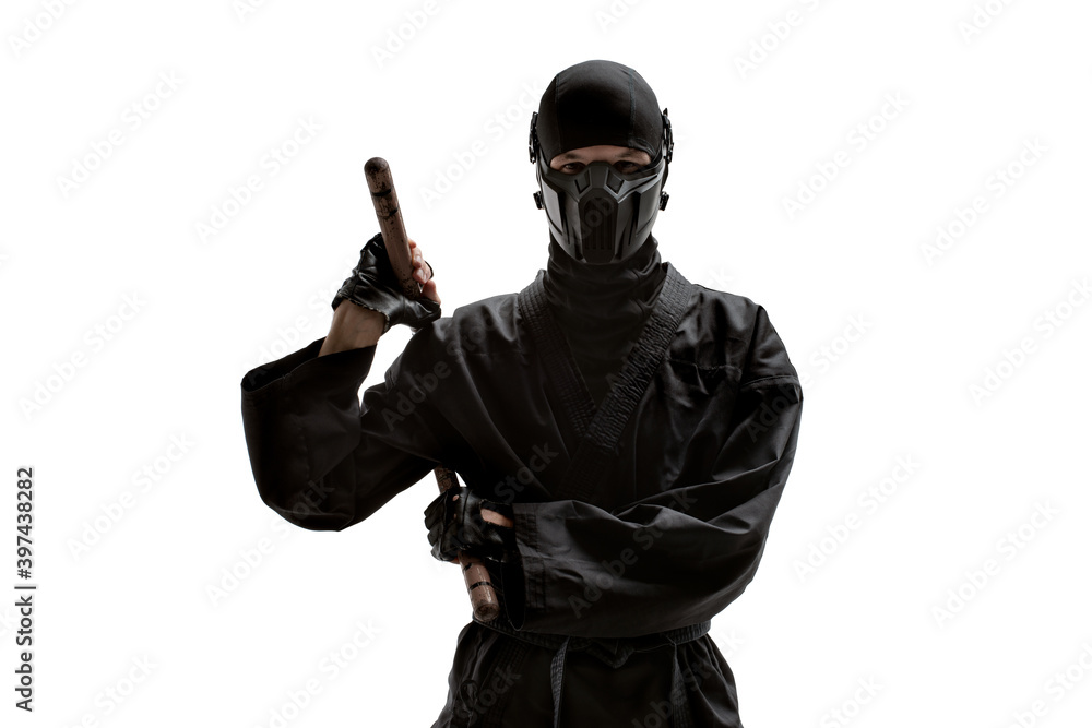 japanese ninja in black uniform with nunchuks cold weapon, on white background, isolated