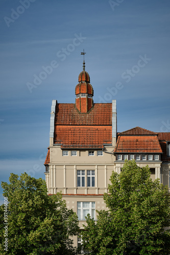 Der prachtvolle Eckturm eines denkmalgeschützten Wohn- und Geschäftshauses prägt das Bild der Altstadt von Neuruppin (Blick vom Schulplatz) photo