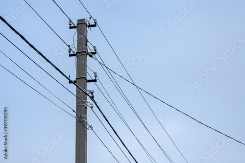 Wallpaper Mural Interlacing electric wires with lights against the sky. Silhouette of a pillar Torontodigital.ca
