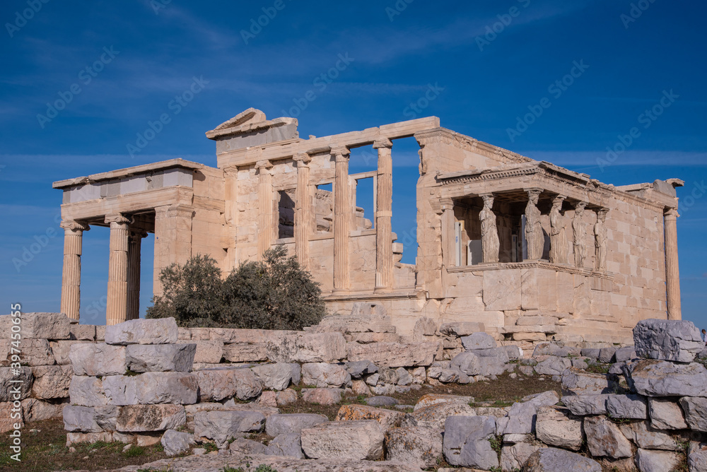 The Erechtheion or Erechtheum, an ancient Greek temple on north side of the Acropolis of Athens in Greece, dedicated to Athena and Poseidon, Greek Gods,
overlooking Athens, Greece.