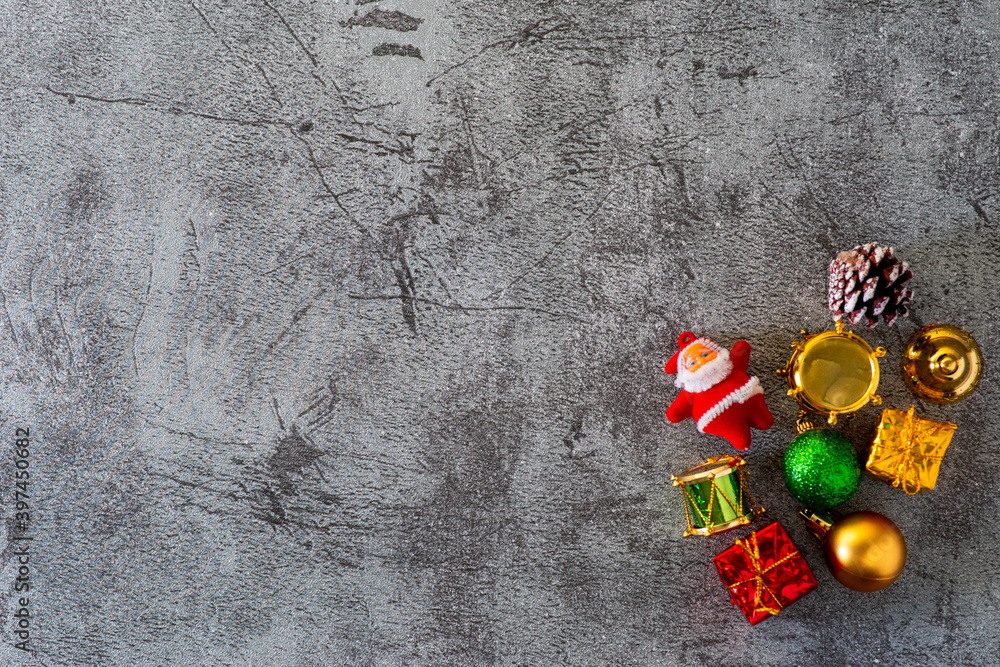 Flat lay view of Christmas decoration objects over concrete gray backdrop with copy space Flat lay view of Christmas decoration objects over concrete gray backdrop with copy space