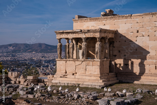 The Erechtheion or Erechtheum, an ancient Greek temple on north side of the Acropolis of Athens in Greece, dedicated to Athena and Poseidon, Greek Gods, overlooking Athens, Greece.