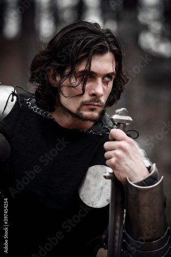 Knight in armor and with a sword. Medieval warrior