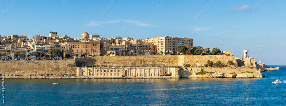 The Grand Harbour side of the city of Valletta, Malta. Showing the Lower Barrakka Gardens, Pixkerija (old fish market) and the Siege Bell Memorial.