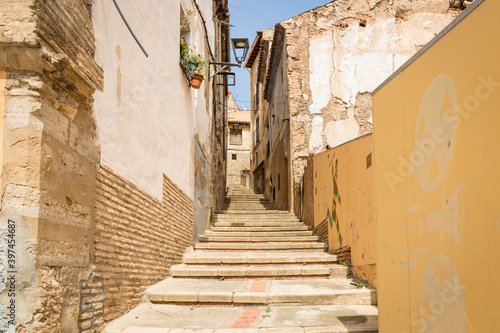 a narrow street with stairs and traditional old houses in Tarazona, province of Zaragoza, Aragon, Spain © Jorge Anastacio