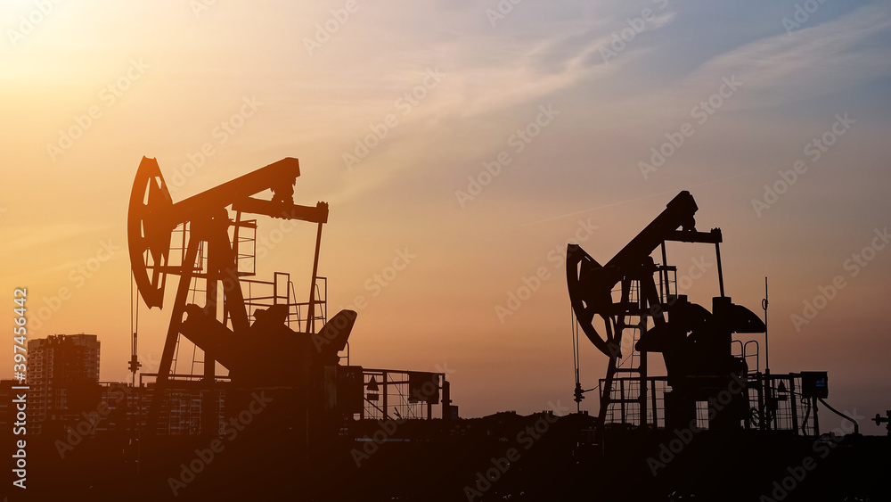 Oil drill rig and pump jack. Petroleum production, natural gas.