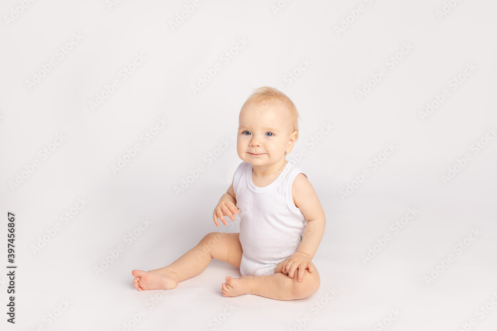 happy little child sitting on white isolated background happy little child sitting on white isolated background