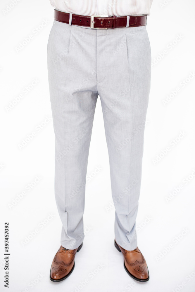 A man in a classic suit. Studio photo on a white background. Snapshot as for a catalog. A man in a classic suit. Studio photo on a white background. Snapshot as for a catalog.