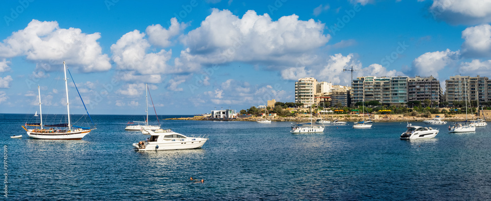 Yachts moored in Saint Julians Bay close to Sliema, Malta.