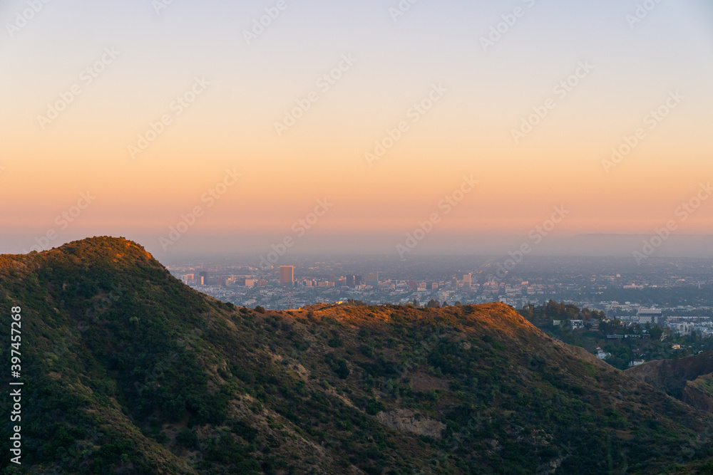 a view of the hollywood mountains during golden hour in los angeles, california