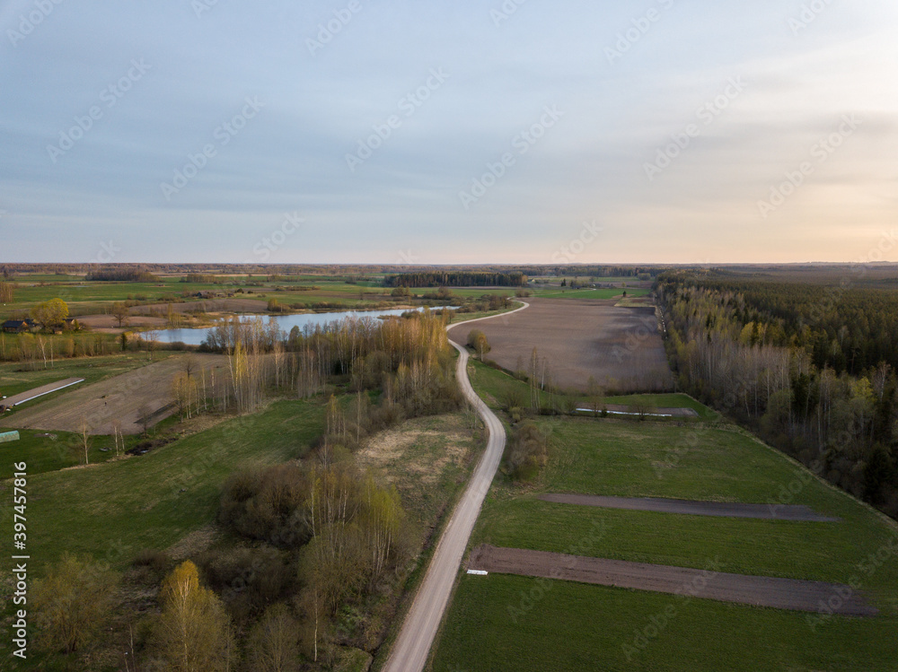 summer fields forests and roads in countryside view from above drone image