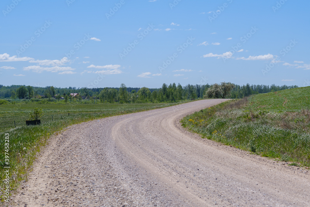 endless beautiful country gravel road in perspective