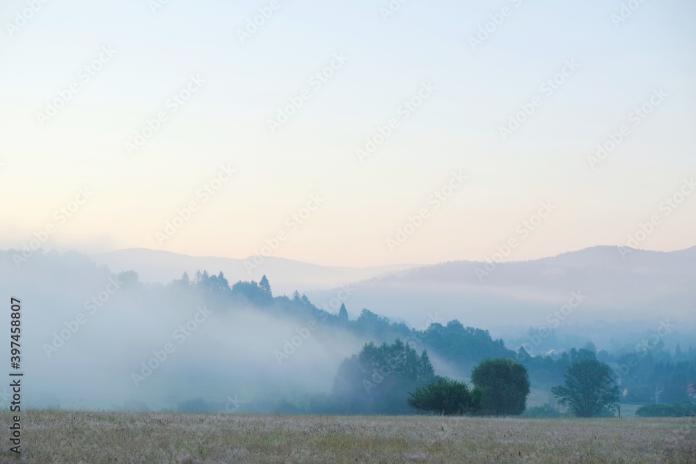 Beautiful misty morning landscape fo Krempna village in Low Beskid Mountains, Poland