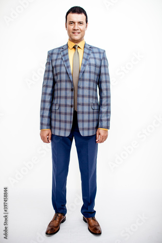 A man in a classic suit. Studio photo on a white background. Snapshot as for a catalog.