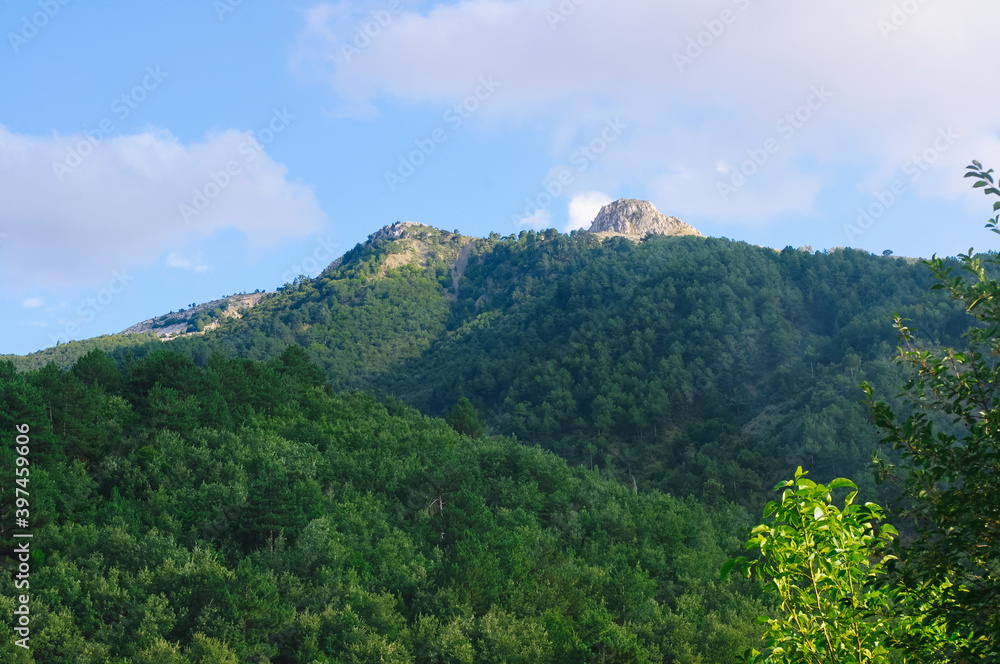 Green mountains and blue sky.