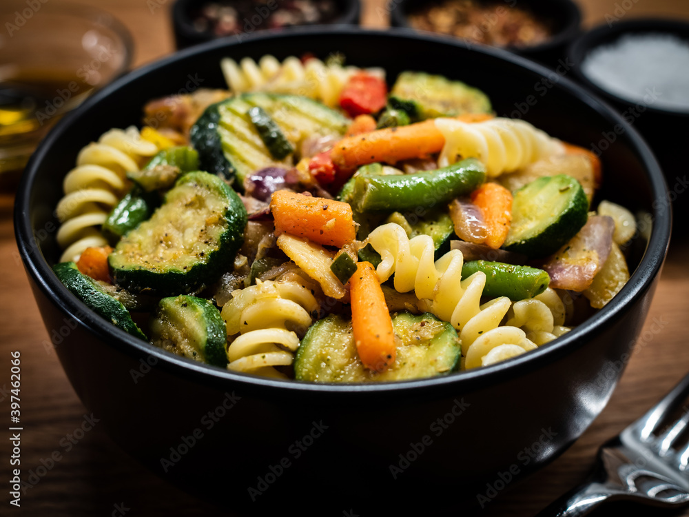 Pork ragout with fusilli and champignon on wooden table
Pork ragout with fusilli and champignon on wooden table