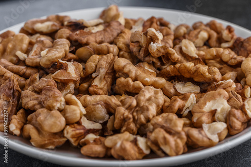 Walnuts shelled. Peeled Raw Walnuts. Fresh organic Nuts. Raw nuts. Many delicious Walnuts as a food background.