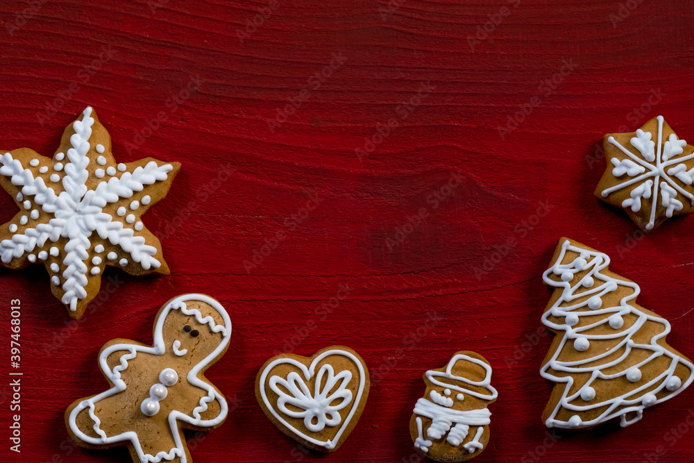 red biscuit gift wooden background new year cookies top view copy space