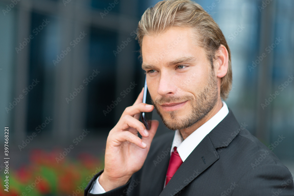 Businessman talking on his mobile phone Businessman talking on his mobile phone