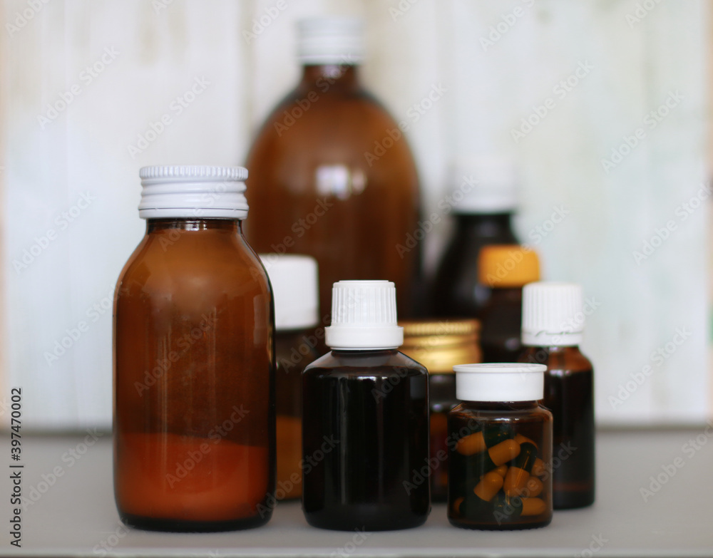 brown bottle with cough syrup on background brown bottle with cough syrup on background