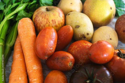 Close up of a bunch assortment of local, organic, eco and sustainable fruits and vegetables from the top view, with zero plastic
