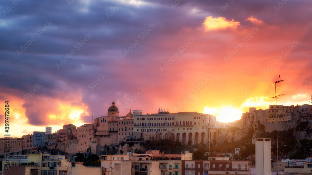 Panoramic view of Cagliari city on sunset. Cagliari skyline during stunning red and blue sunset.