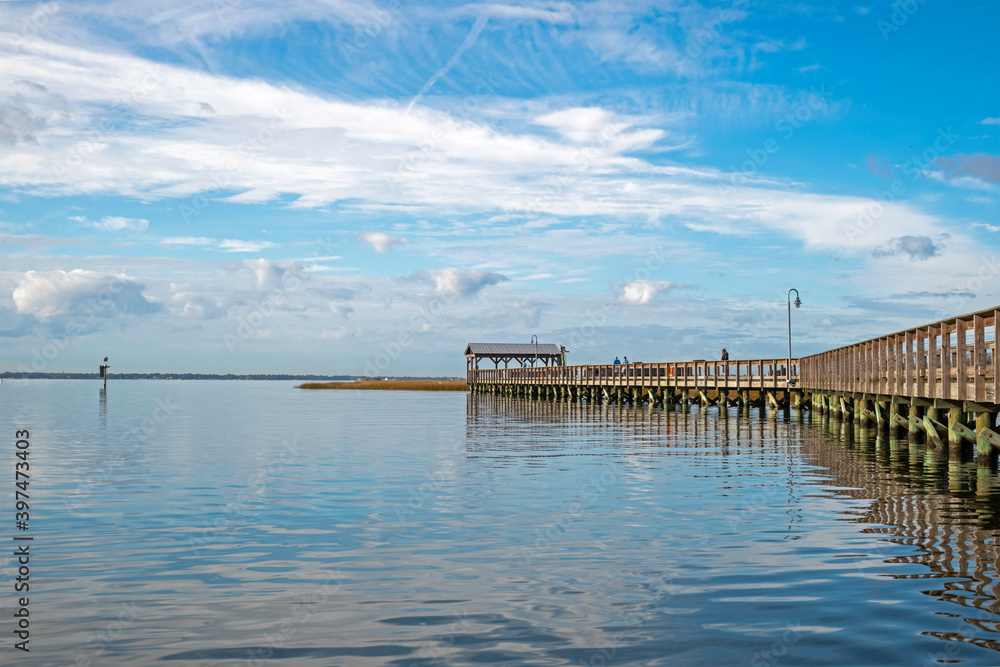 Pier overlooking Charleston Harbor, a popular spot for tourists and fishermen.