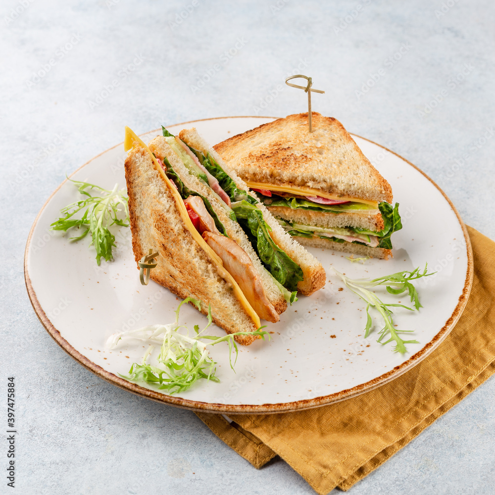 Group of club sandwiches with chicken on white bread