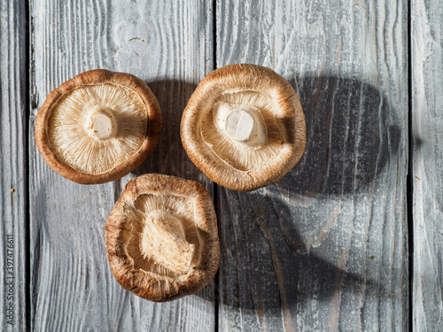 Shiitake mushrooms on wooden background.