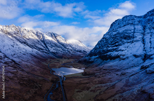 aerial view of Glen Coe in winter near rannoch moor in the argyll region of the highlands of scotland showing snow dusting on the mountains and munros photo