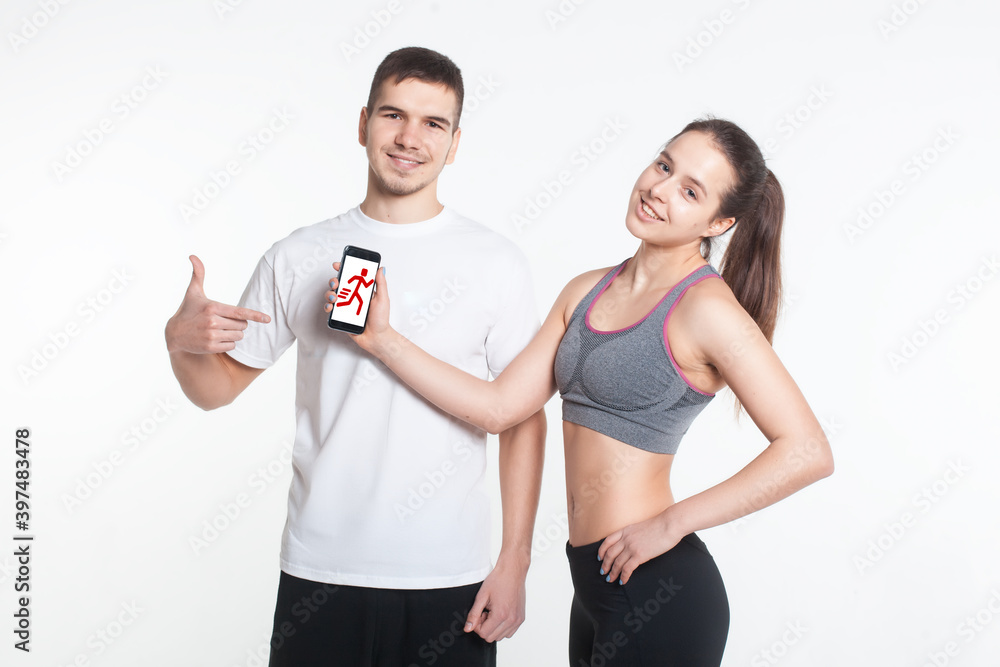 young male and female online workout with smart phone isolated young male and female online workout with smart phone isolated