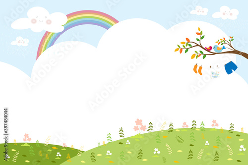 Spring or Summer landscape with rainbow and blue sky,Kids clothes hanging on the branches tree, Banner template with copy spave for Spring season, Summer time or Easter concept