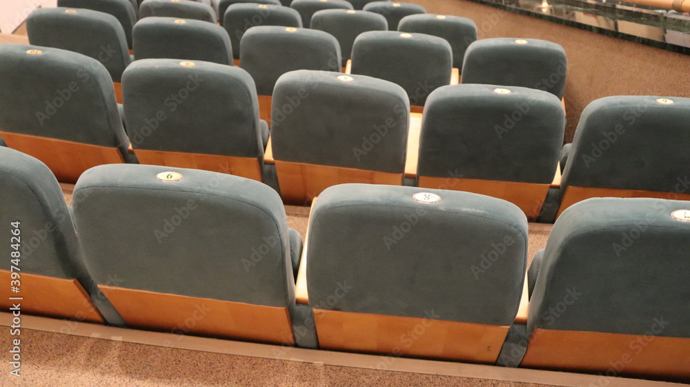 row of cozy seats in european theatre row of cozy seats in european theatre