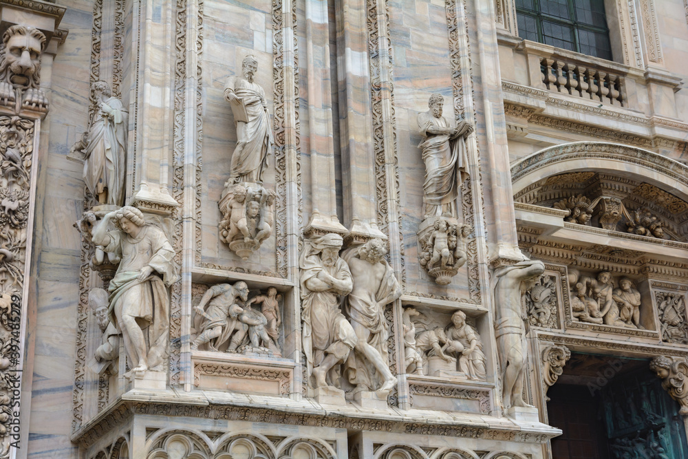 Sculptures at the main entrance to Milan Cathedral. Duomo Cathedral. Italy.