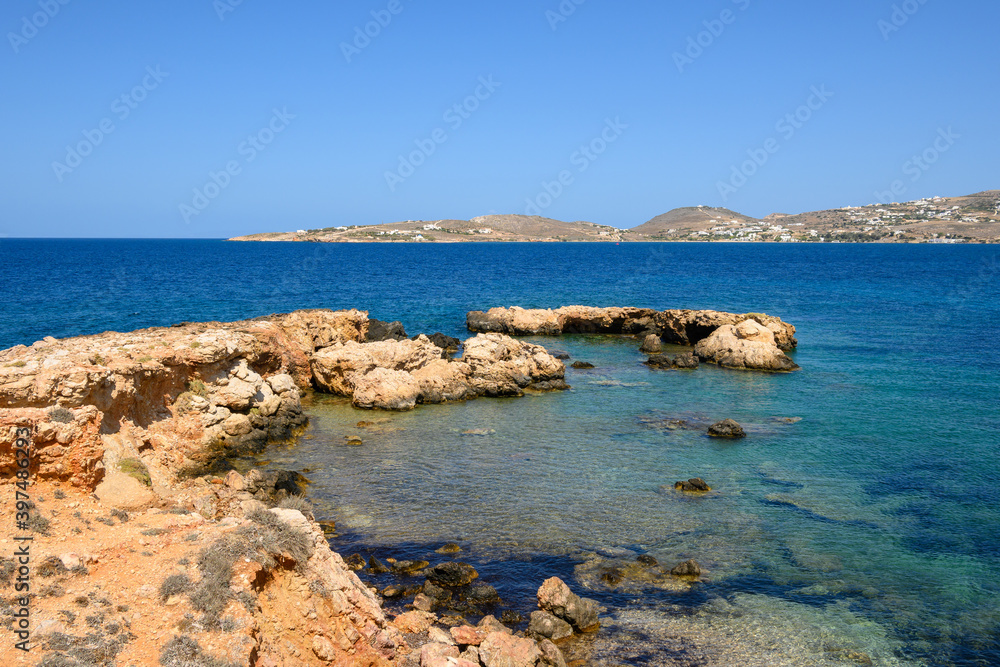 Rocky coast with crystal turquoise water of Paros Island, Cyclades, Greece