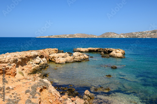 Rocky coast with crystal turquoise water of Paros Island, Cyclades, Greece