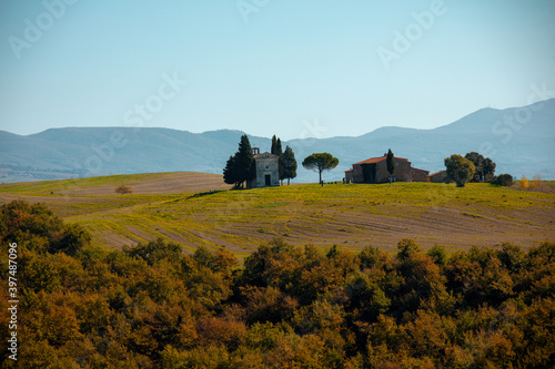 landscape with hills and trees in Tuscany, Italy in autumn