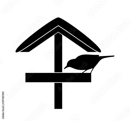 snowy bird table and bird silhouette isolated on white background