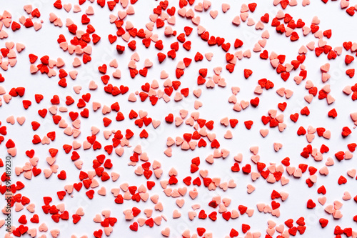 sprinkles background  sugar sprinkle red hearts  decoration for cake and bakery. Top view  flat lay. Valentines holiday