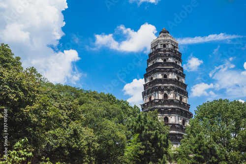 Photography Tiger Hill Pagoda (Pagoda of Yunyan Temple) over trees on Tiger Hill (Huqiu) in